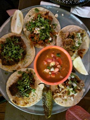 Taco Platter with Mexican brisket, tomatillo chicken, carnitas, and bistec. I've never had 4 favorites before! at Cascabel in Houston