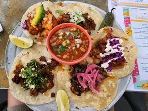 5 Taco platter. Starting from top going clockwise: bistec, tinga, fajitas, al pastor, Baja (+delicious charro beans in the middle!) at Cascabel in Houston