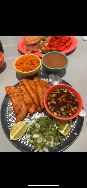 Birria with side of refried beans and rice at Cascabel in Houston