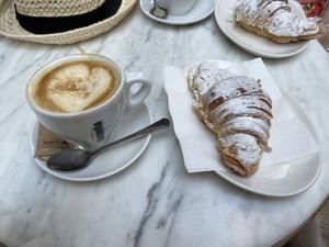 Chocolate croissant and oat milk latte  at The Vegan Corner in Barcelona
