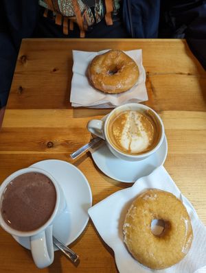 Sugar donuts, hot chocolate and cafe latte at The Vegan Corner in Barcelona