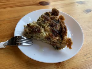 Asparagus and leek quiche- so savory and delicious- also found a few sundried tomatoes in there😻  at The Vegan Corner in Barcelona