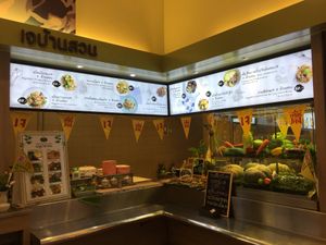 Shop front with the little เจ flags at Vegan Garden House in Chiang Mai