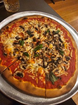 Plain cheese pizza 🍕 with added mushrooms at Dudley's in Olinda
