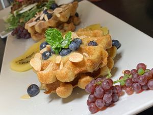 Sweet Potato Waffle: Almond, Blueberries, Gold Kiwi, Beet Sugar, Vanilla Sauce, Champagne Grapes at Juice By J in Grand Rapids