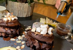 Torching the Vanilla Marshmallows on the Sweet Potato Dark Cacao Waffle:  Pear, Dragonfruit, Dark Chocolate Michigan Cherry Sauce at Juice By J in Grand Rapids