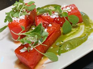 Grilled Watermelon:  Cashew “Feta”, Micro-Greens, Cilantro Avocado Aioli at Juice By J in Grand Rapids