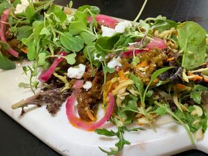 Cucumber Tostadas:  Cashew “Feta”, Red Onions, Micro-Greeens at Juice By J in Grand Rapids
