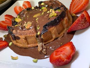 Dubai-style Waffle: Pistachio Chocolate Fig Sauce, Strawberries, Pistachios at Juice By J in Grand Rapids