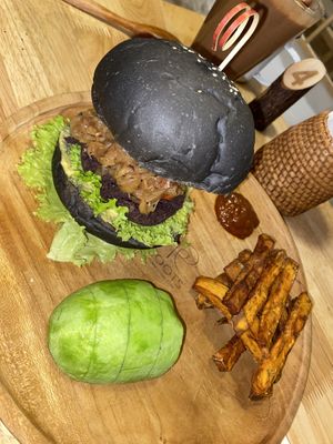 Burger with extra avocado and sweet potato fries  at Roots in Hanoi