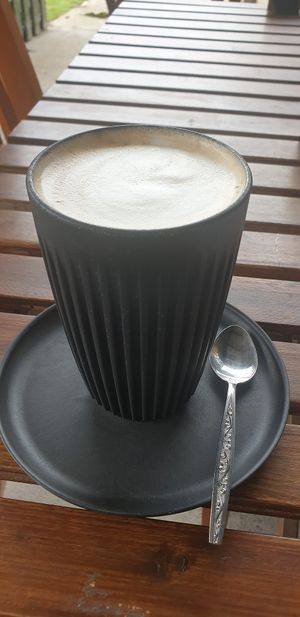 Bonsoy latte in huskee cup✅ at The Yoga Place Cafe in Blacksmiths