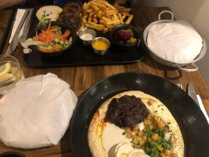 hummus plate and vegan kebab dish at Nish Nush in Cologne