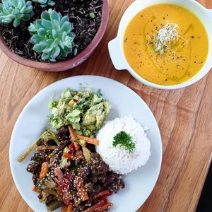 pumpkin and red pepper soup with veggies and soy protein sauté in teryaki sauce with salad and citronela rice  at Lulo's Restaurante in Jardin