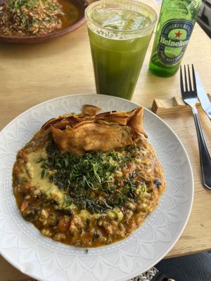 Risotto de Jambu (a fruit from the Amazonian forest) and Cilantrata (a refreshing coriander  drink served with your choice of beer - alcohol free and gluten-free options available) at Jamburita in Brasilia