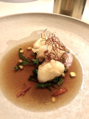 Steamed spiced  silken tofu, puffed rice, chilli, fragrant oils, sesame

 at Ezard in Melbourne