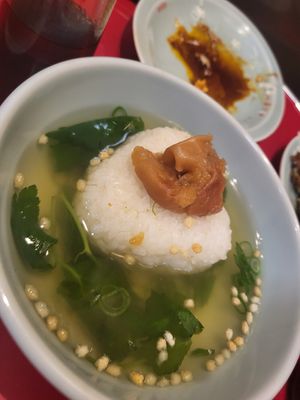 Green tea with rice and umeboshi (pickled plum) at Izakaya Masaka in Tokyo