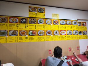 Menu displayed on the wall inside  at Izakaya Masaka in Tokyo