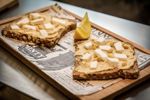 Hummus, vegan cheese and pine nuts toast at Super Be Juicery in Marbella