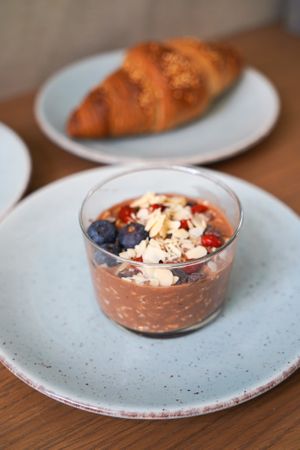 Overnight oats and vegan croissant (made of espelta and quinoa)  at Super Be Juicery in Marbella
