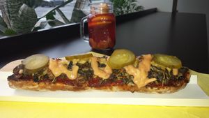 Caramelised onion, mushroom and v-cheese baguette. Fruit-infused spiced tea (herbaty) in background. at Wat Kam Chu in Gdynia