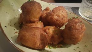Roasted vegetable fritters with ras el hanout spices and almond and tomato-based Romesco sauce at Blat al Sac in Mallorca
