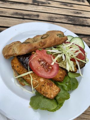 Focaccia burger with tofu rosso, grilled vegetables and pesto   at Bio-Cafe Kieselstein in Potsdam