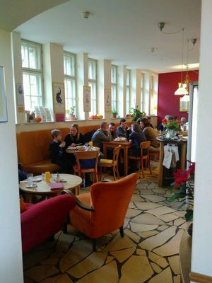 Cosy indoor seating area at Bio-Cafe Kieselstein in Potsdam