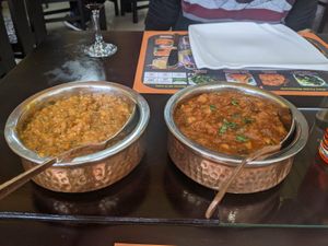 Eggplant curry and a chana masala at Sher E Punjab in Banos De Agua Santa
