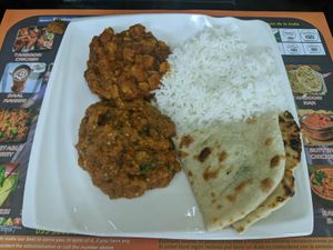 Curries come with rice and bread at Sher E Punjab in Banos De Agua Santa