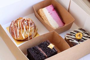 Treat box - berry cheezecake, apple custard brioche swirl, sachertorte, banana cake with black tahini at Chez Malachy - Preorder only in Brussels