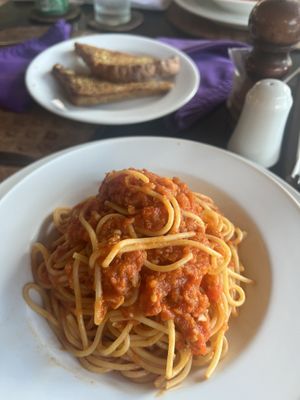 Vegan pasta and garlic breadd  at Asmara in 