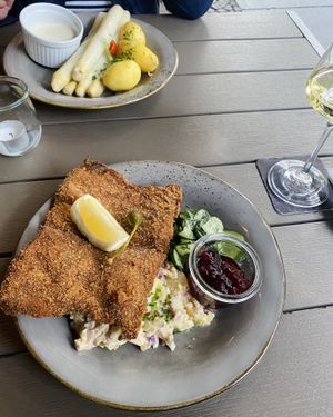 Wiener Schnitzel with potato salad and cucumber salad and aspargus with potatoes  at Försters in Berlin