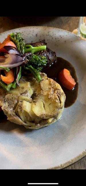 Roulade with potatoes. The Roulade is filled with mustard and pickles   at Försters in Berlin