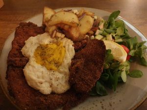 Schnitzel with fried egg and potatoes at Försters in Berlin