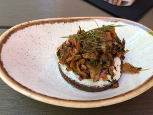 Gruß aus der Küche: Pumpernickel mit Frisch"käse" und Karottenlachs at Försters in Berlin
