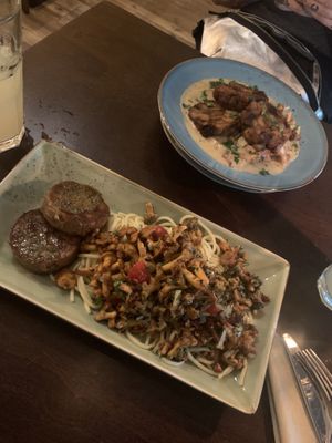 A chanterelles pesto sause on noodles with medallions of seitan and bread dumplings with a chanterelles cream sauce and smoked tofu at Försters in Berlin