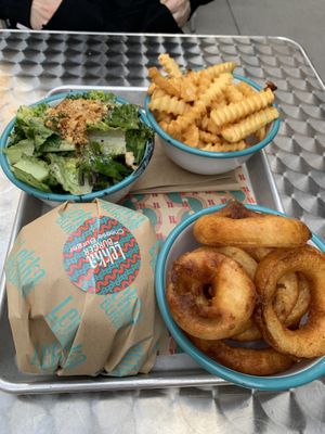 Onion rings, Caesar salad, cheeseburger, and fries  at Lekka Burger in New York City
