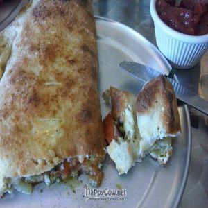 calzone (w/ tomatoes, caramelized onions, pesto & basil) at Peace o' Pie in Allston