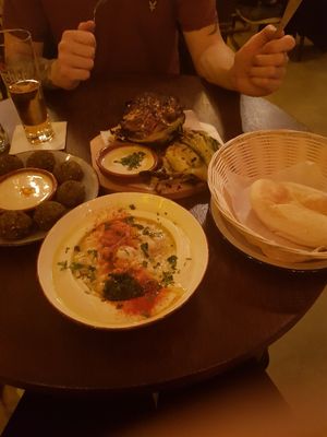 Houmous bowl came with pita bread. Roasted cauliflower. Falafel with dip at TLV Eatery in Budapest