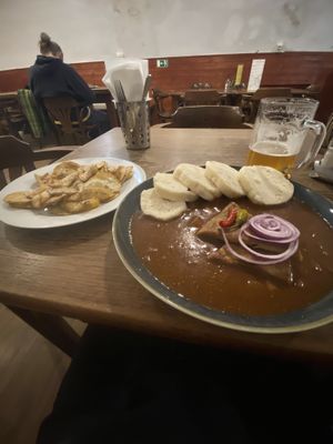 Goulash with fried potato side  at Vegalite in Brno