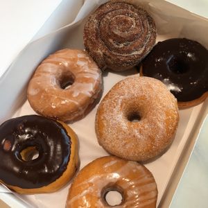 Vegan chocolate, glazed, and sugar donuts, and the vegan cinnamon roll at Johnny Doughnuts in Larkspur