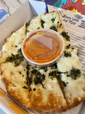 Spinach Artichoke Cheesy Bread 💚  at Peace Love and Pizza in Alpharetta
