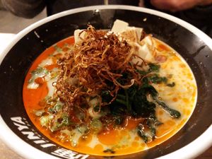 Spicy Creamy Vegan Ramen: vegetable broth: tofu, onion, green onion, spinach, crispy onion, garlic chips, garlic oil, chili oil, sesame seeds, served with thick noodles. at JINYA Ramen Bar in Santa Monica