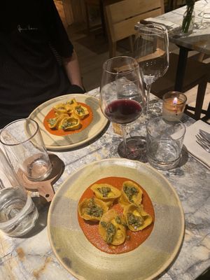 Tortelloni with a ricotta-ish filling made from lemon grass, tomato-white pesto sauce  at MESA Restaurant in Paris