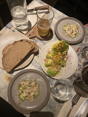 Smoked mushroom with avocado cream, salad with spicy seeds and sour dough bread  at MESA Restaurant in Paris