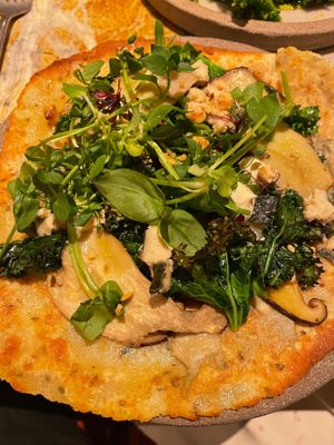 Quinoa flatbread with vegetable creme, cashew-nut cheese and mushrooms. at MESA Restaurant in Paris