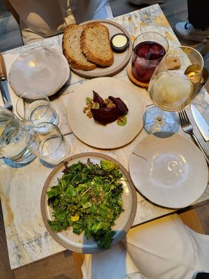Cacao baked beets (creme vegetal, kombucha chimichurri); signature salad (seasonal greens, beetroot molasses, spiced seed crumble) at MESA Restaurant in Paris