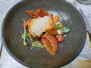 Main dish, polenta with tomatoes at MESA Restaurant in Paris