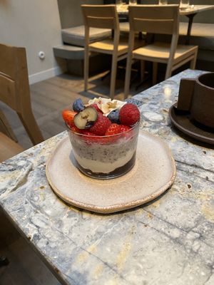 Overnight oats - hibiscus infused w/ vanilla yogurt, jam and seasonal fruits  at MESA Restaurant in Paris