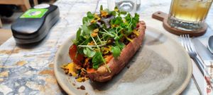 Herbed black quinoa, chorizo, curcuma kraut, massage kale & wild leaves, warm cheesy sauce & golden granola at MESA Restaurant in Paris